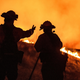 Fire fighters keep watching an approaching fire line on the outskirts of Santa Rosa, on September 27, 2020.